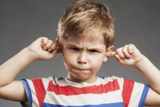  Boy plugging his ears