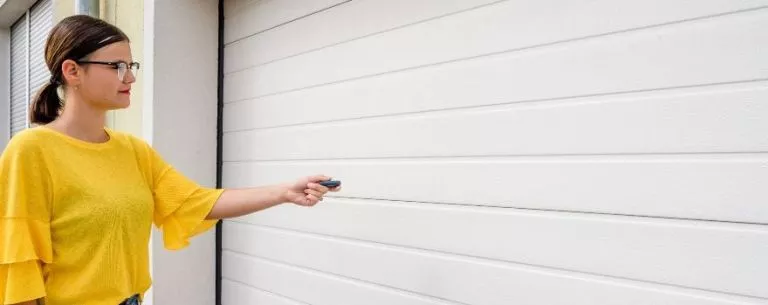 Lady with garage door handle